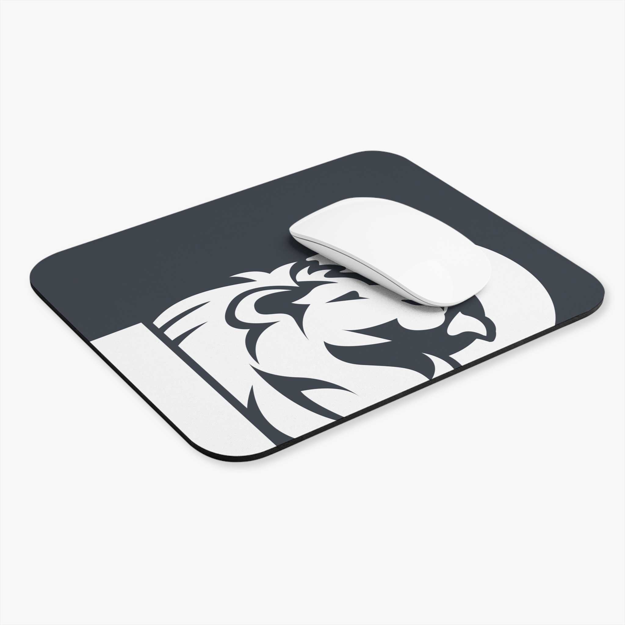 The Lion Logo Mouse Pad — Minimal Dark Desk Mat for Office & Gaming features a bold, modern white lion graphic on a dark background. Shown here with a white wireless mouse placed on top, its sleek design suits any workspace or gaming setup.
